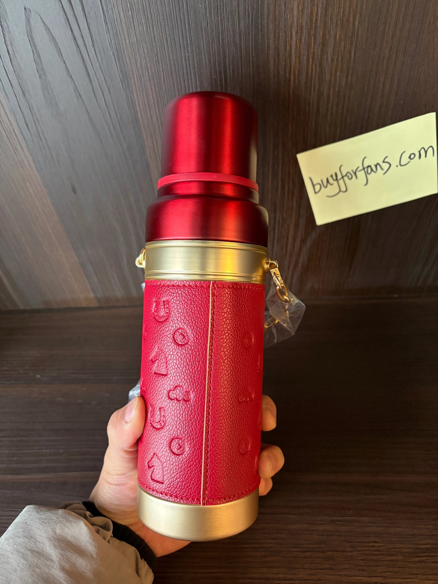 Starbucks New Year of Horse red thermos cup held in hand