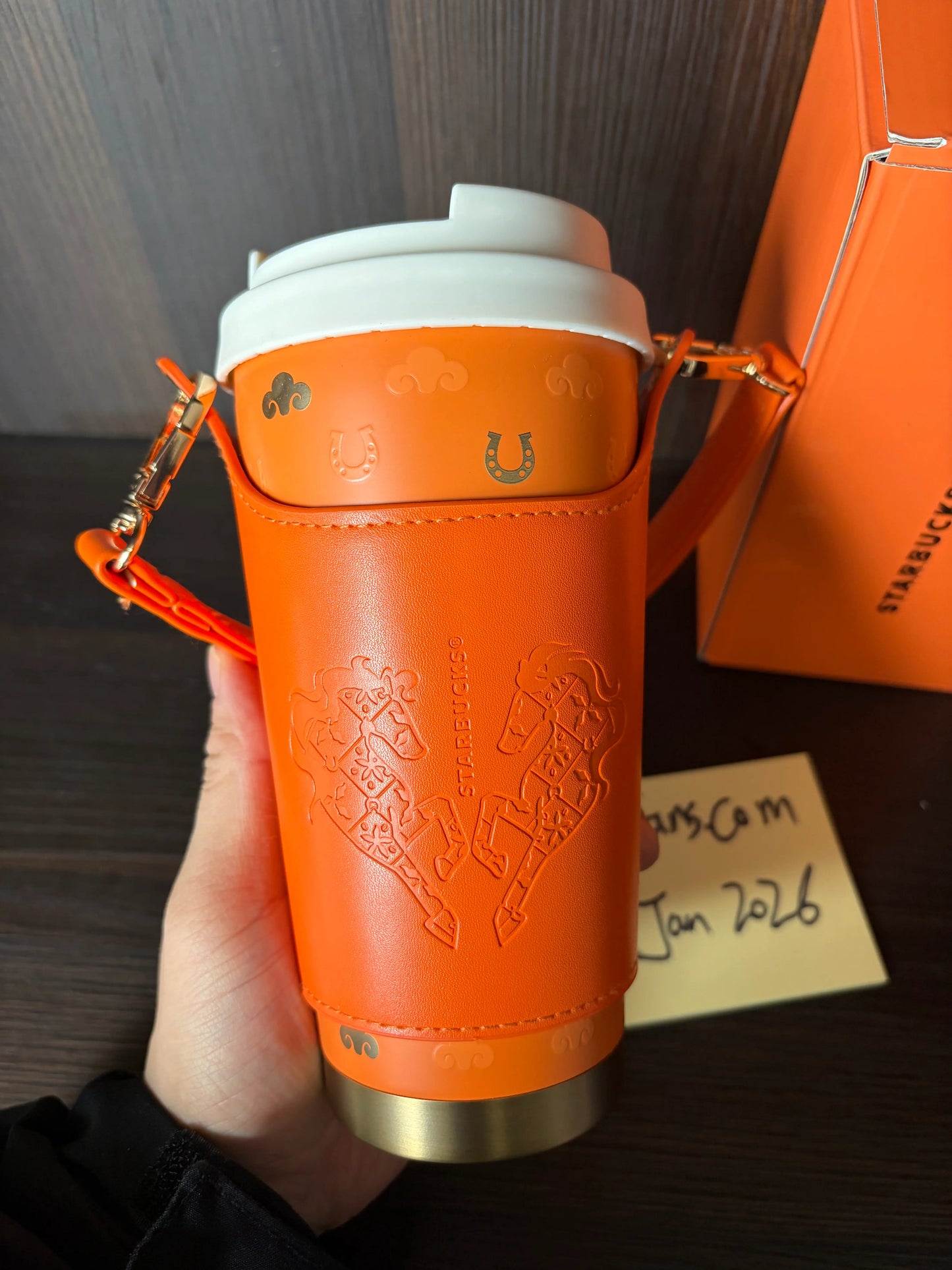 Starbucks 2026 China New Year of Horse tabletop cup held in hand showing size and texture