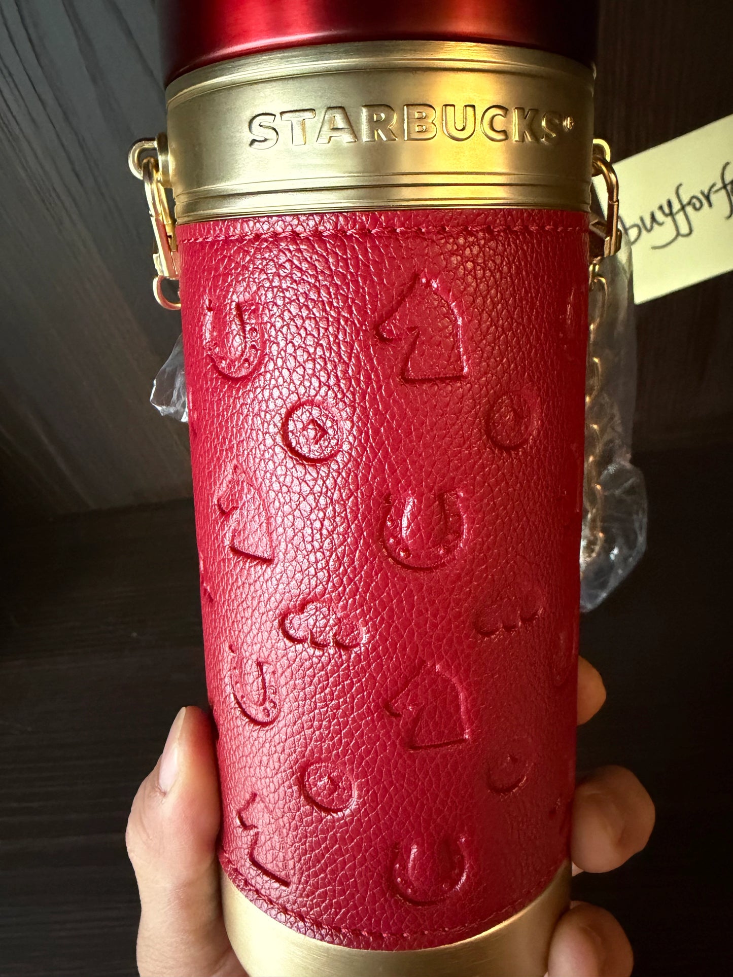 Detail of Year of the Horse design on Starbucks red thermos cup